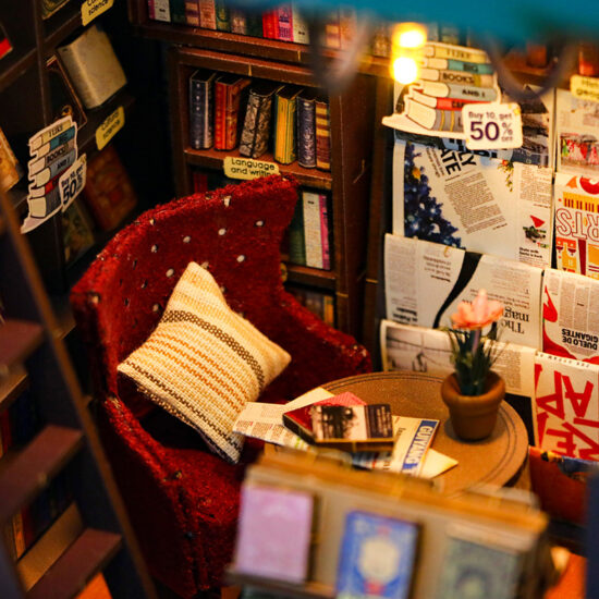 Miniature wooden bookstore dollhouse with bookend function