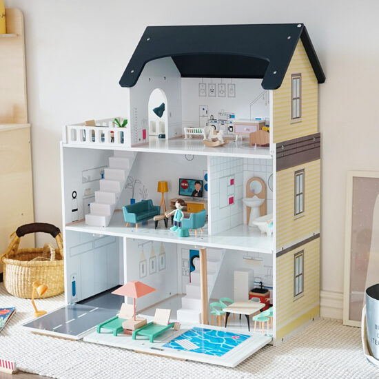 Large wooden princess dollhouse toy with multi-room layout