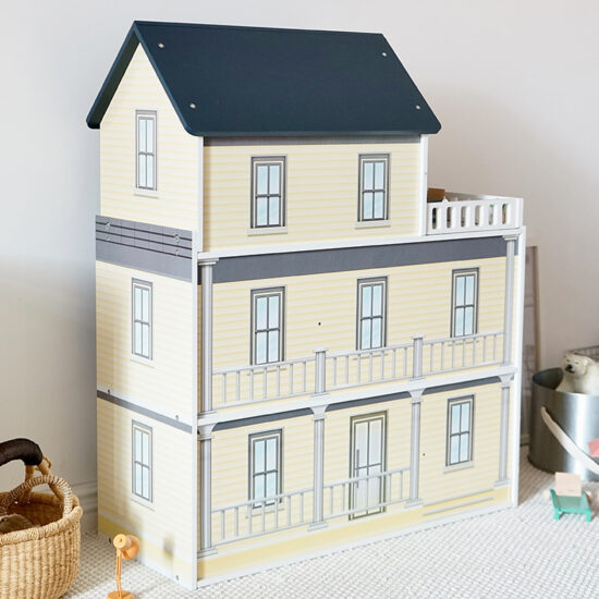 Large wooden princess dollhouse toy with multi-room layout